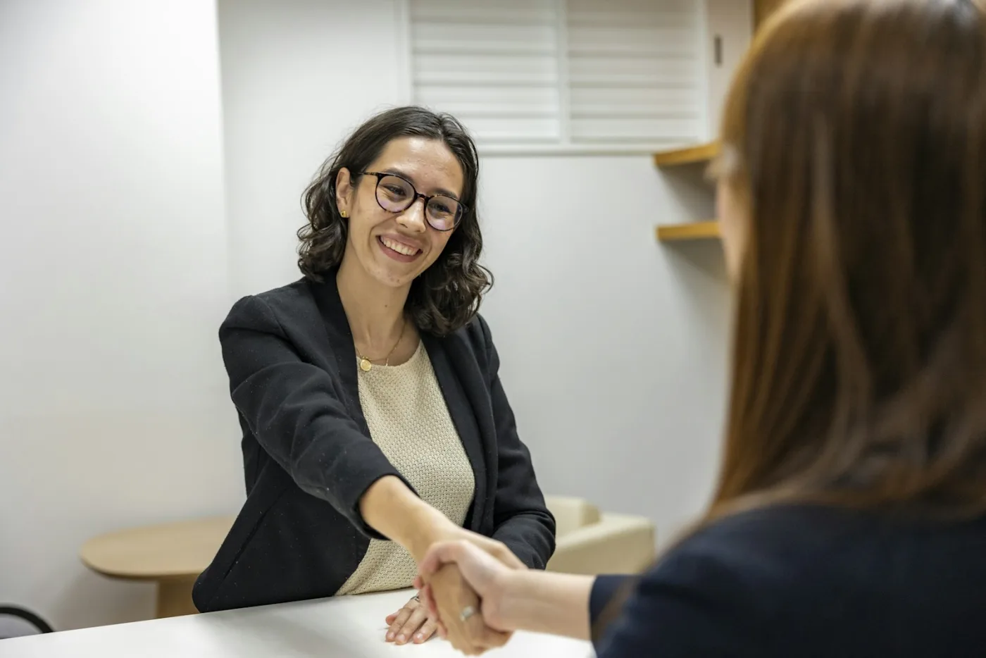 Employer and candidate shaking hands after an interview